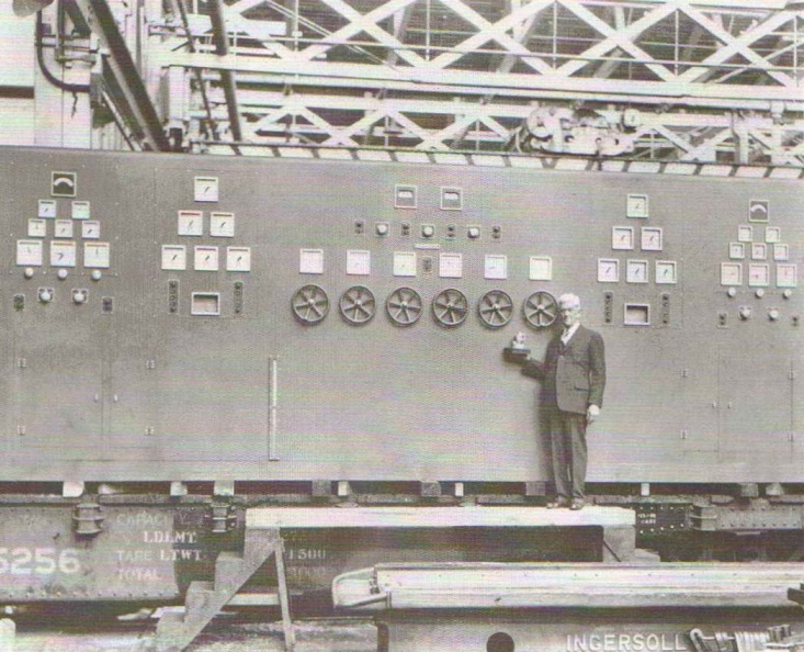 Elmer Woodward with his smallest and largest Woodward governor controls_ca_ 1937.jpg